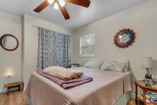 bedroom featuring ceiling fan and light hardwood / wood-style floors