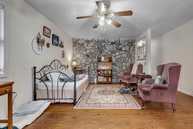 bedroom with hardwood / wood-style floors