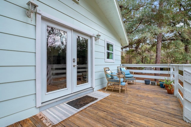 wooden deck featuring french doors