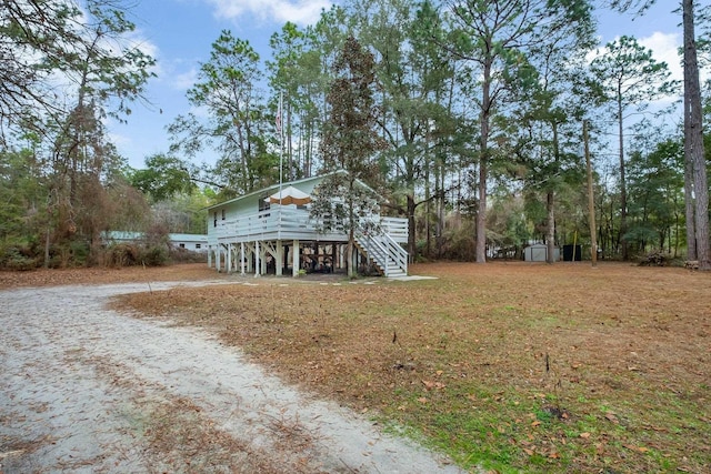 exterior space with a carport and a storage unit