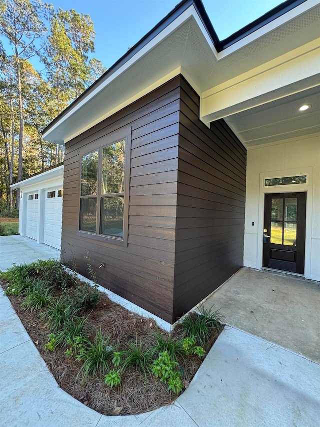 view of side of property with a garage