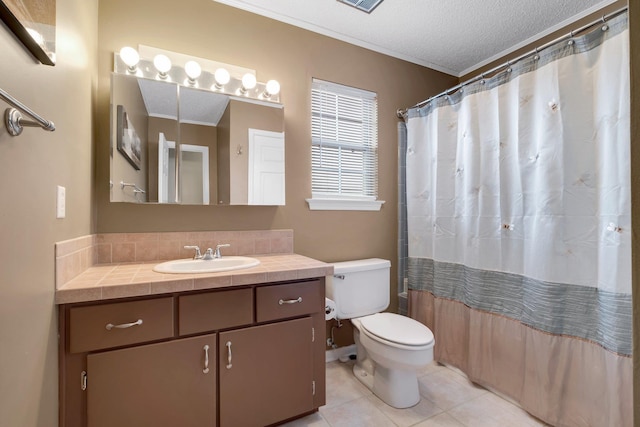 bathroom with tile patterned flooring, vanity, toilet, crown molding, and a textured ceiling