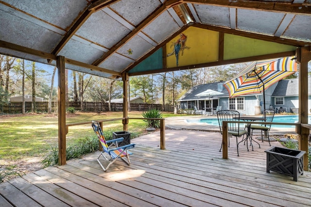 wooden terrace featuring a gazebo, a fenced in pool, and a lawn