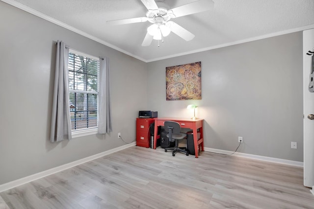 office space with ornamental molding, light wood-type flooring, ceiling fan, and a textured ceiling