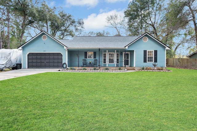 single story home with a garage, a front yard, and covered porch