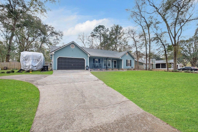 ranch-style house with a garage and a front lawn