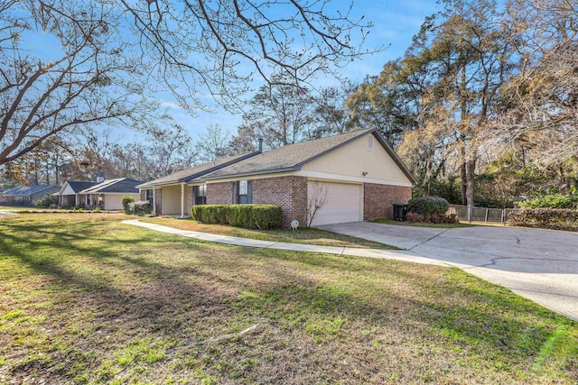 ranch-style house featuring a garage and a front yard