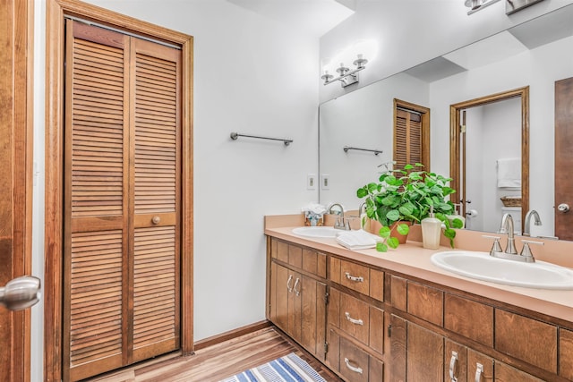 bathroom featuring vanity and hardwood / wood-style flooring