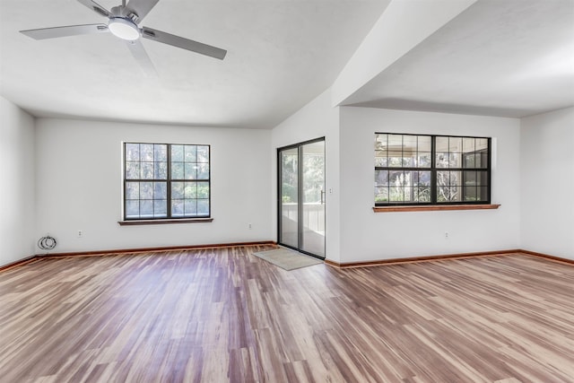 empty room featuring ceiling fan and light wood-type flooring