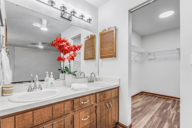 bathroom with vanity and hardwood / wood-style floors