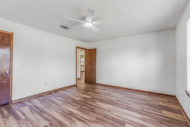 spare room featuring ceiling fan and light hardwood / wood-style floors