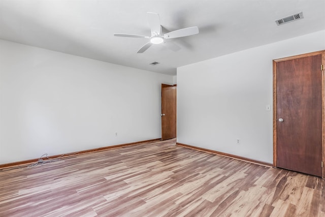 unfurnished room featuring ceiling fan and light wood-type flooring