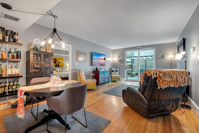 300 S Duval St # 508, Tallahassee, FL 32301 - dining area with wood finished floors and a bar