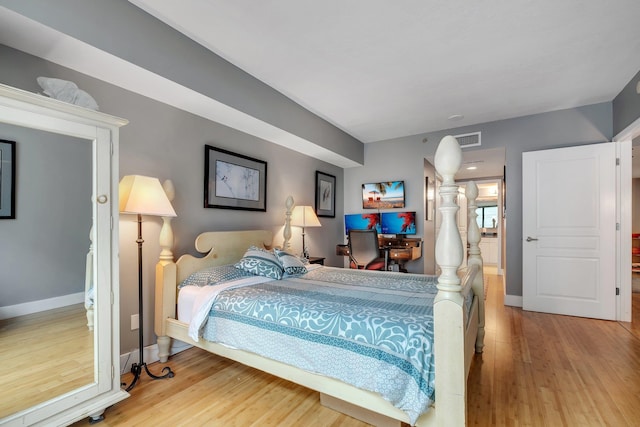 300 S Duval St # 508, Tallahassee, FL 32301 - bedroom featuring wood finished floors and baseboards