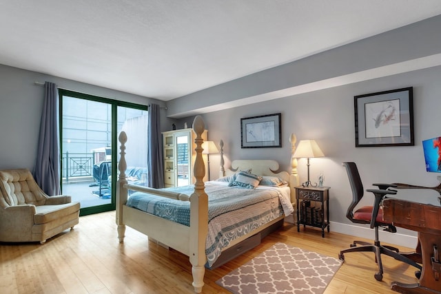 300 S Duval St # 508, Tallahassee, FL 32301 - bedroom featuring access to exterior, light wood-style floors, baseboards, and a desk