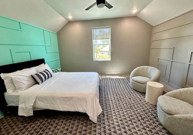 carpeted bedroom with ceiling fan and lofted ceiling