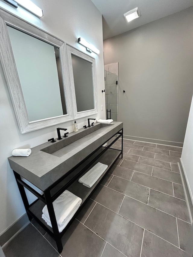 bathroom featuring tile patterned flooring and an enclosed shower