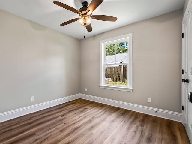 45 Sioux Trl, Crawfordville, FL 32327 - unfurnished room with baseboards, ceiling fan, and wood finished floors