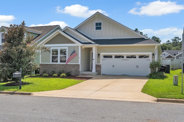 craftsman-style home with a garage and a front lawn