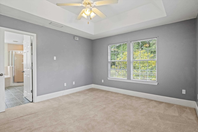 3770 Laurel Trace Way, Tallahassee, FL 32303 - carpeted spare room featuring a raised ceiling, a ceiling fan, baseboards, and tile patterned floors