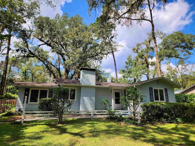 ranch-style home with a front lawn