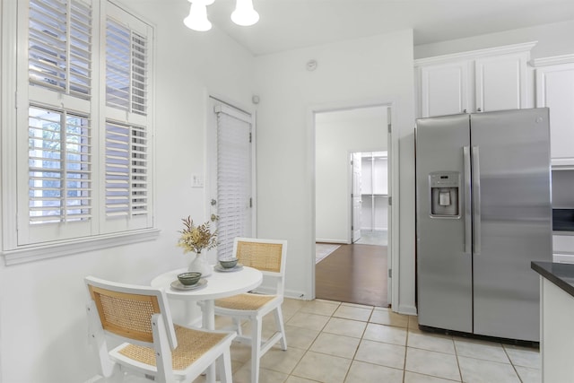 dining area featuring light tile patterned floors