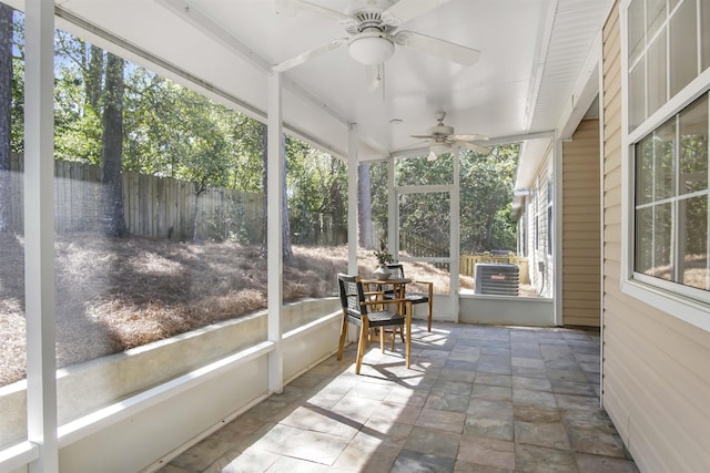 sunroom with a ceiling fan