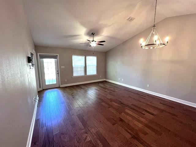 4783 Cypress Brooke Way Unit 4783 & 4787, Tallahassee, FL 32311 - empty room featuring dark wood finished floors, ceiling fan, lofted ceiling, and a chandelier