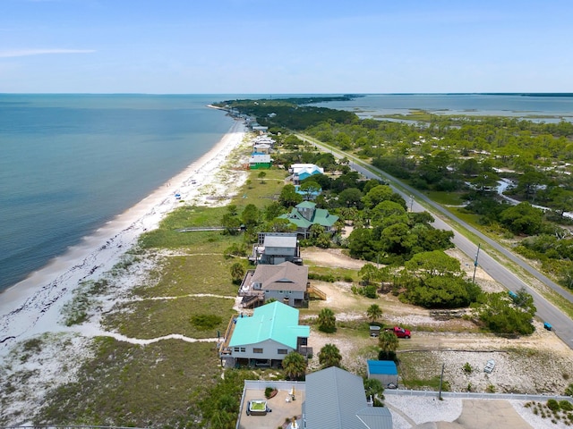 birds eye view of property with a beach view and a water view