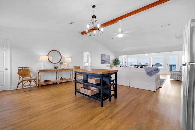 dining room with high vaulted ceiling, light wood-type flooring, ceiling fan with notable chandelier, and beam ceiling