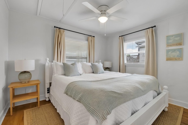 bedroom with wood-type flooring and ceiling fan