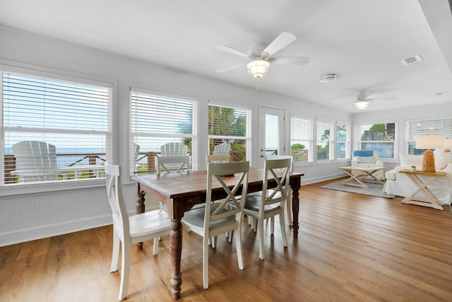 dining space featuring hardwood / wood-style floors and ceiling fan