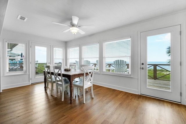 dining room featuring wood-type flooring and ceiling fan