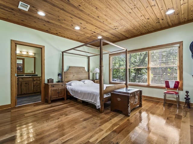 bedroom with ornamental molding, ensuite bath, wood-type flooring, and wooden ceiling