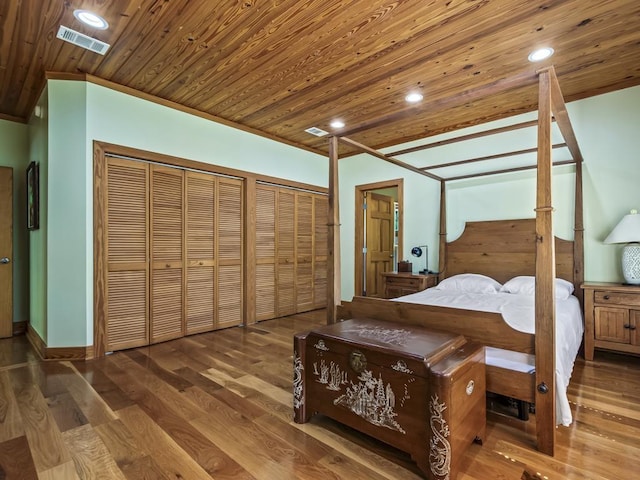 bedroom featuring hardwood / wood-style flooring and wooden ceiling