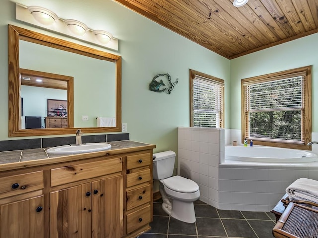 bathroom with tiled tub, vanity, wooden ceiling, tile patterned floors, and toilet