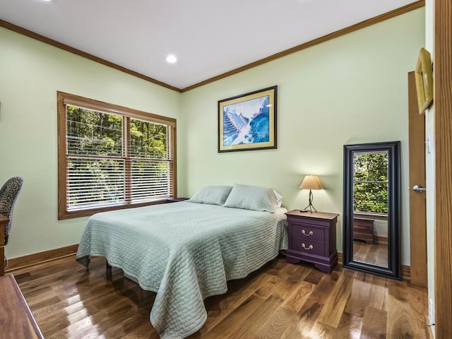 bedroom with multiple windows, crown molding, and dark wood-type flooring