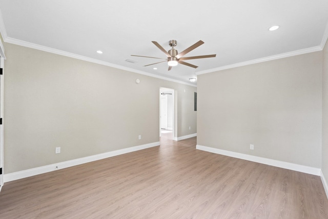 spare room with light hardwood / wood-style flooring, ceiling fan, and crown molding