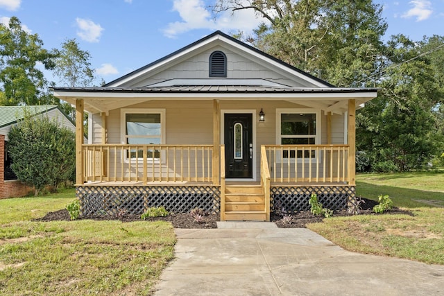 bungalow-style house featuring a porch and a front lawn