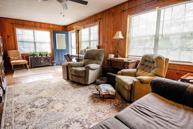 319 Gaile Ave, Tallahassee, FL 32305 - living room with a ceiling fan, wooden walls, and a healthy amount of sunlight