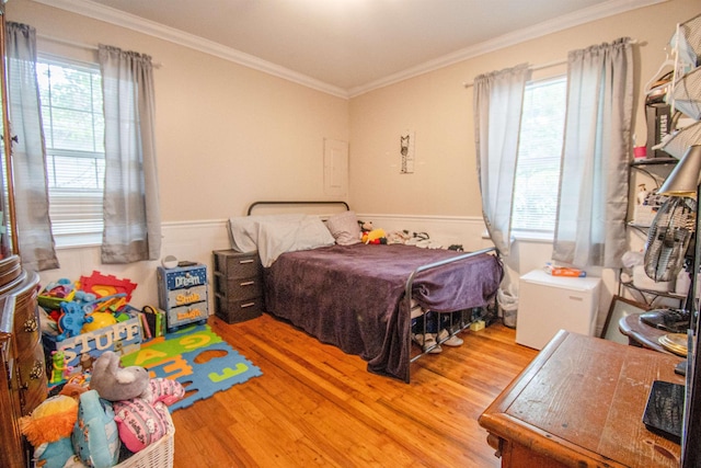 319 Gaile Ave, Tallahassee, FL 32305 - bedroom with crown molding, wood finished floors, and multiple windows