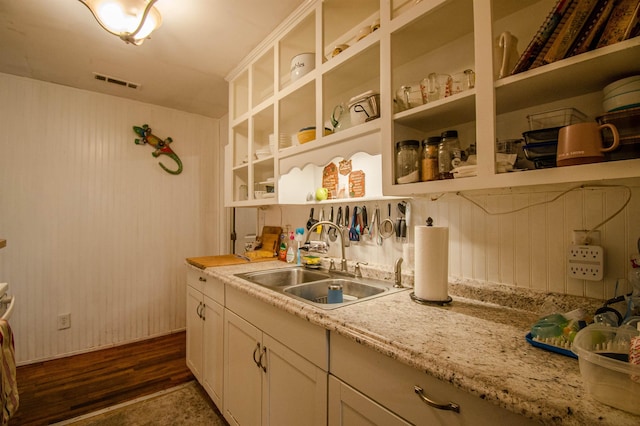319 Gaile Ave, Tallahassee, FL 32305 - interior space with visible vents, open shelves, dark wood-style floors, white cabinetry, and a sink