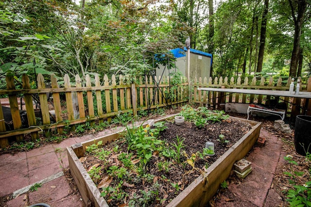 319 Gaile Ave, Tallahassee, FL 32305 - view of yard featuring fence and a vegetable garden