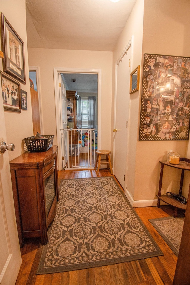 319 Gaile Ave, Tallahassee, FL 32305 - corridor with baseboards and wood finished floors