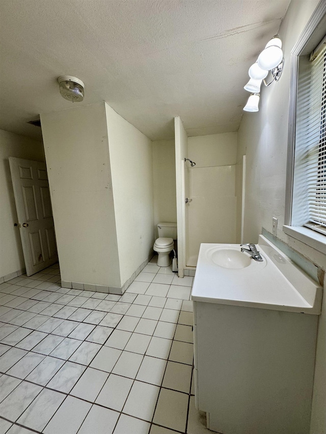 2755 Lake Bradford Rd, Tallahassee, FL 32310 - full bath featuring toilet, vanity, tile patterned floors, a textured ceiling, and a shower