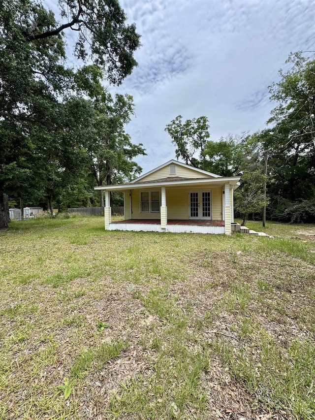 2755 Lake Bradford Rd, Tallahassee, FL 32310 - back of property with a porch and french doors