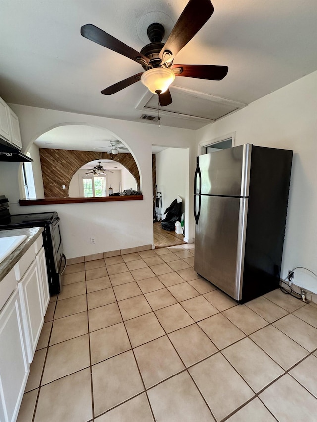 2755 Lake Bradford Rd, Tallahassee, FL 32310 - kitchen featuring freestanding refrigerator, a ceiling fan, white cabinets, and range with electric cooktop