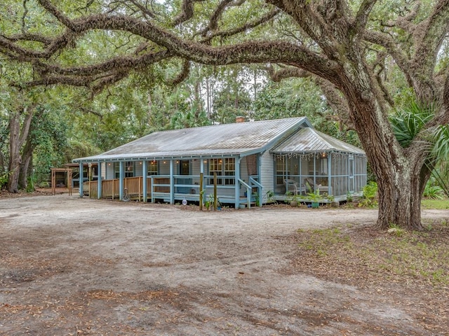 view of front of home featuring a sunroom