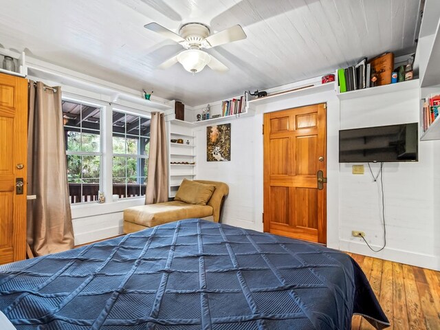 bedroom with hardwood / wood-style floors and ceiling fan