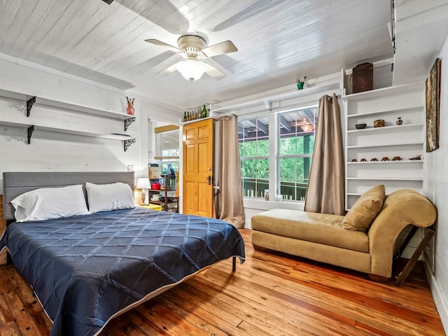 bedroom with hardwood / wood-style floors and ceiling fan